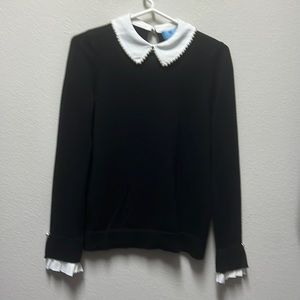 Classic black sweater with white collar and pearl trim